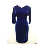 A 1960s midnight blue velvet wiggle dress, medium size.