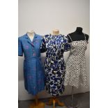 Three 1960s day dresses, including linen sundress with blue polka dot print and pleated skirt, white
