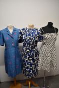 Three 1960s day dresses, including linen sundress with blue polka dot print and pleated skirt, white