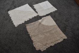 Three highly detailed crochet edged tablecloths, one having beautiful deer and tree pattern to