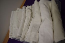 A good collection of vintage and antique bed sheets, including linen.