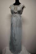 A very pretty 1930s bias cut powder blue nightdress, with fluted sleeve openings edged in tulle lace
