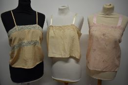 Two 1920s/30s camisoles, both having lace work, one with delicate embroidery, also included is a