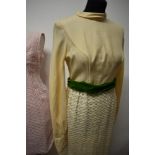 Three vintage 1960s dresses, to include; early 60s pink wiggle dress, cream maxi dress with green