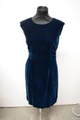 A teal blue velvet 1960s dress, medium size.