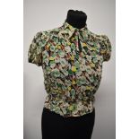 An Art Deco sheer floral crepe blouse, having shirred waist, pointed collar and button fastening.