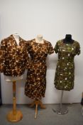 Two late 1950s dresses in green and brown tones, one having matching jacket, medium sizes.