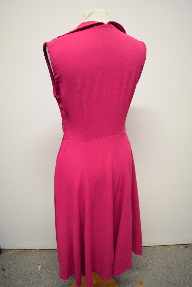 A 1940s cerise crepe dress, having button to bodice, side metal zip and fairly full panelled skirt. - Image 5 of 7