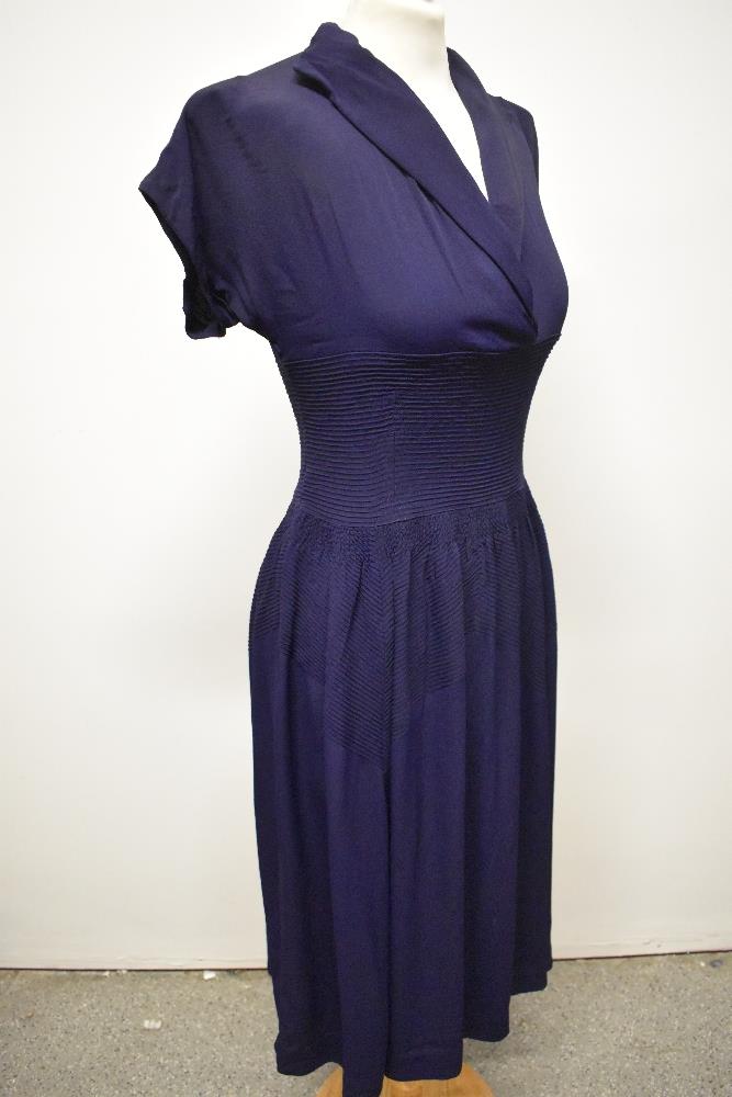 A striking 1940s navy blue floppy crepe day dress, having pointed cross over collar and tiny ribs of - Image 5 of 12