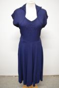 A stunning 1940s navy blue textured crepe day dress, having faux bolero bodice, appliqué detail to