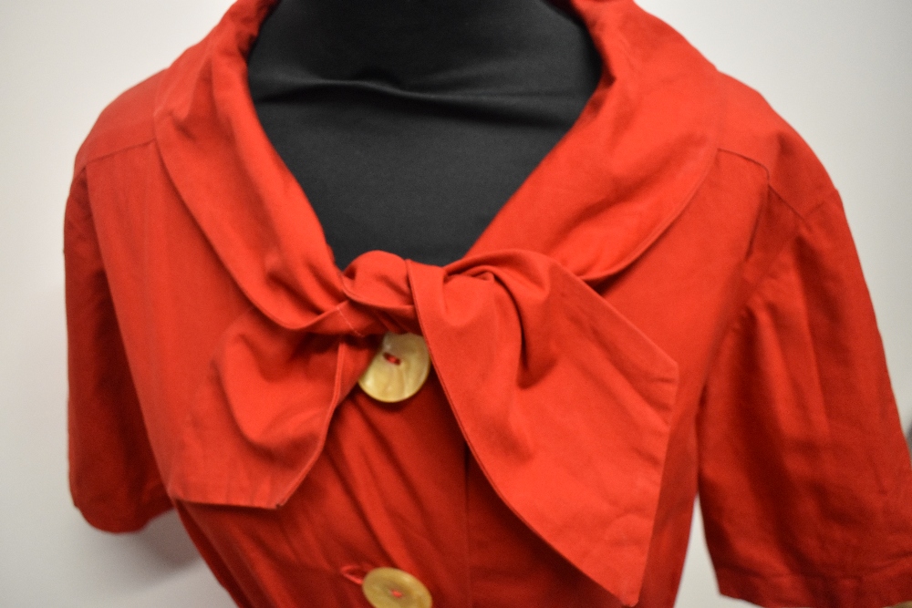 A 1950s medium weight cotton cherry red day dress, having large statement buttons, ties to neck, - Image 7 of 7