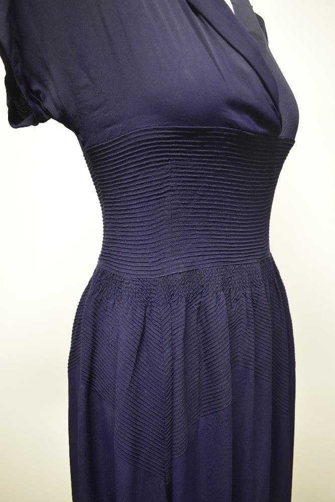 A striking 1940s navy blue floppy crepe day dress, having pointed cross over collar and tiny ribs of - Image 6 of 12