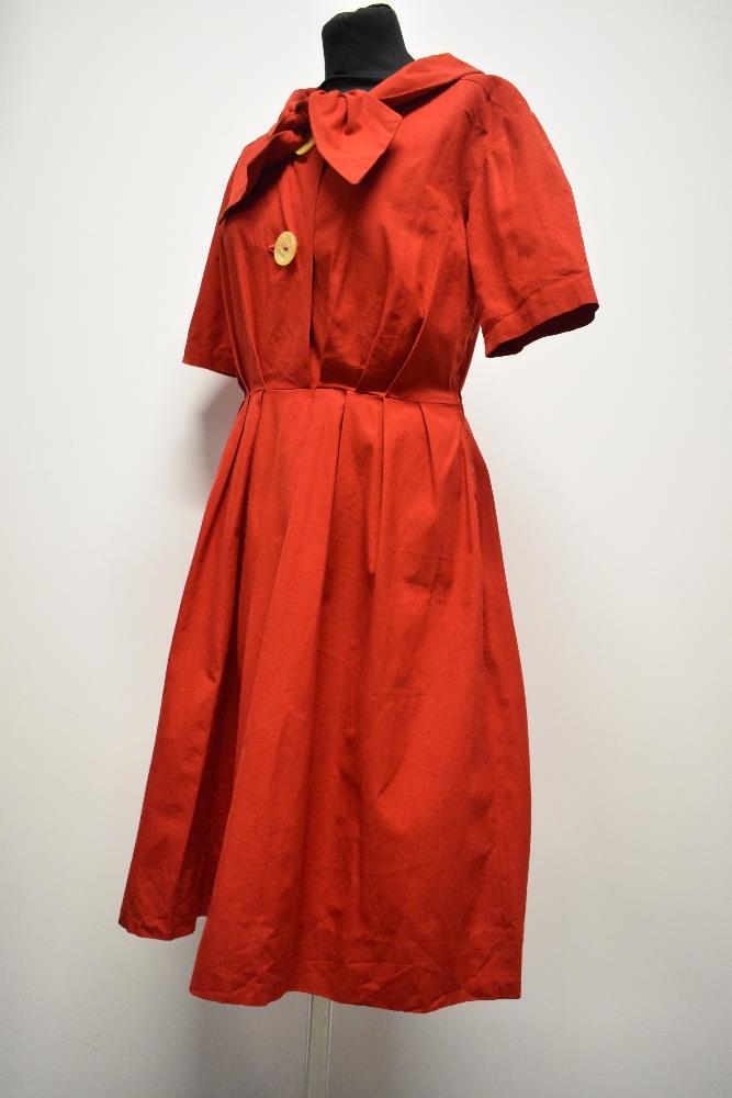 A 1950s medium weight cotton cherry red day dress, having large statement buttons, ties to neck, - Image 6 of 7