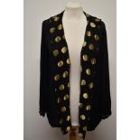 An Art Deco 1930s black crepe jacket, having long gold lamé collar.