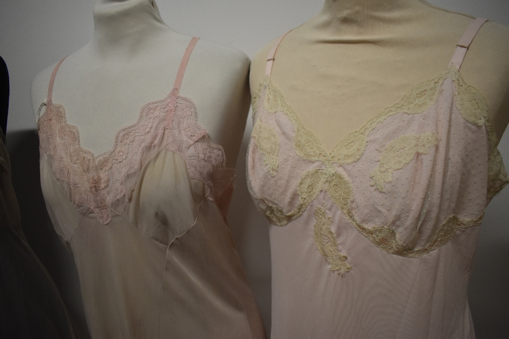 Five 1950s and 1960s sheer and semi sheer nylon slips, all having lace, medium to large sizes. - Image 3 of 12