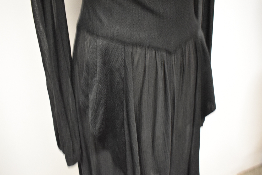 A late 1930s/early 40s semi sheer black day dress, having peplum detail to pointed dropped - Image 3 of 8