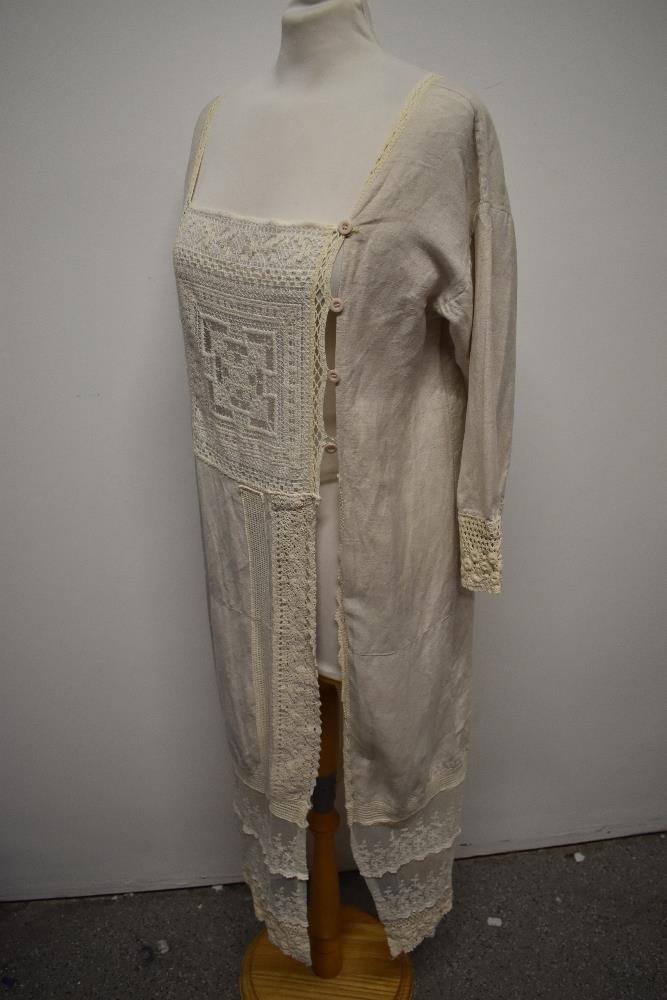 An interesting early 20th century linen smock/ over dress, having embroidered tulle panel to - Image 11 of 12