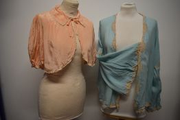 Two 1930s silk be jackets, one in pink with lace to collar and sleeves and the other blue, with deep
