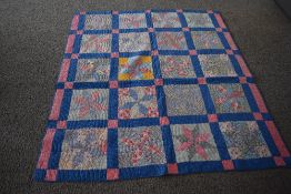 A circa 1920/ 1930s quilt, using block pattern in colourful fabrics, possibly American, very good