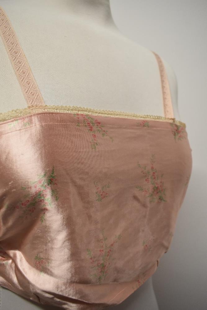 A 1940s strapless pink satin finish bra and a 1920s bralette with shirred back. - Image 5 of 10