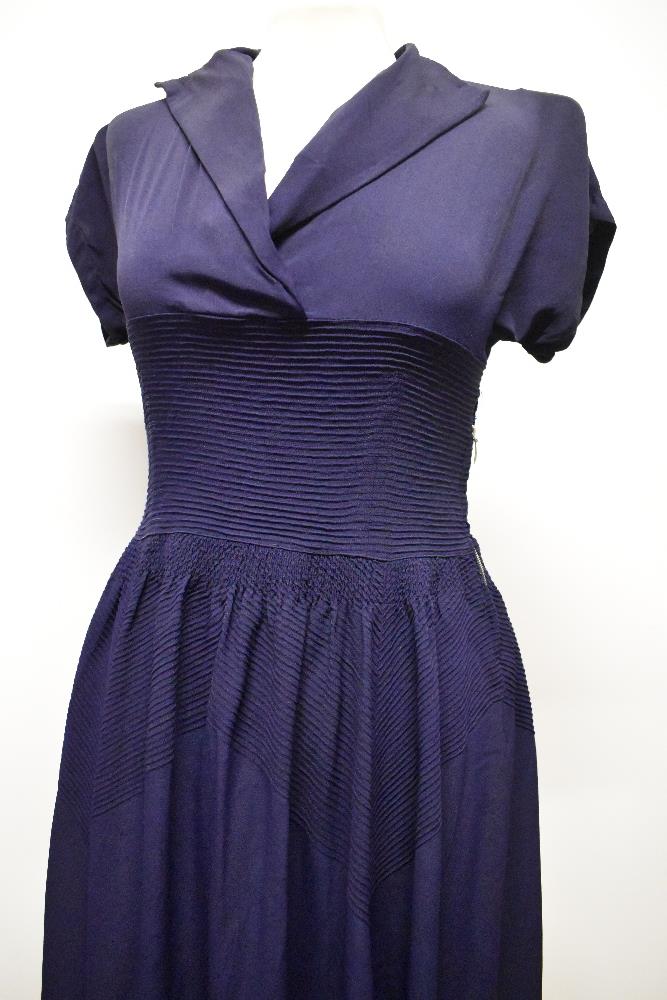 A striking 1940s navy blue floppy crepe day dress, having pointed cross over collar and tiny ribs of - Image 2 of 12