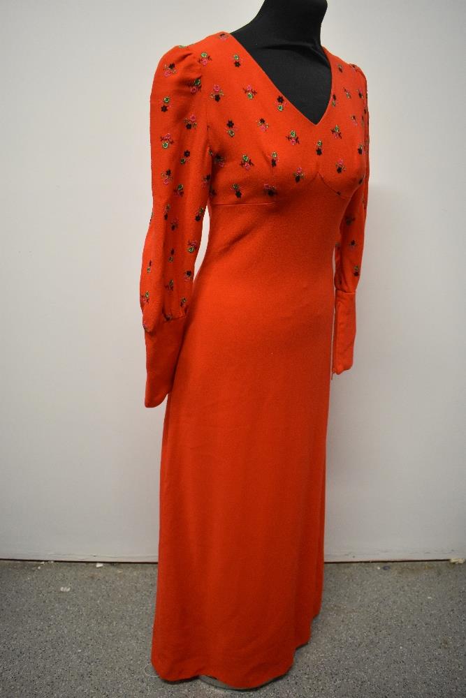 A striking 1960s cherry red maxi dress of wool crepe type fabric, having embroidery to bust and