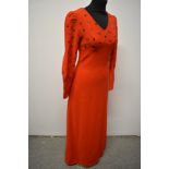 A striking 1960s cherry red maxi dress of wool crepe type fabric, having embroidery to bust and