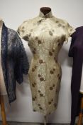 A 1950s Champagne coloured Cheongsam with brown Chrysanthemum pattern and two similar jackets/ cover