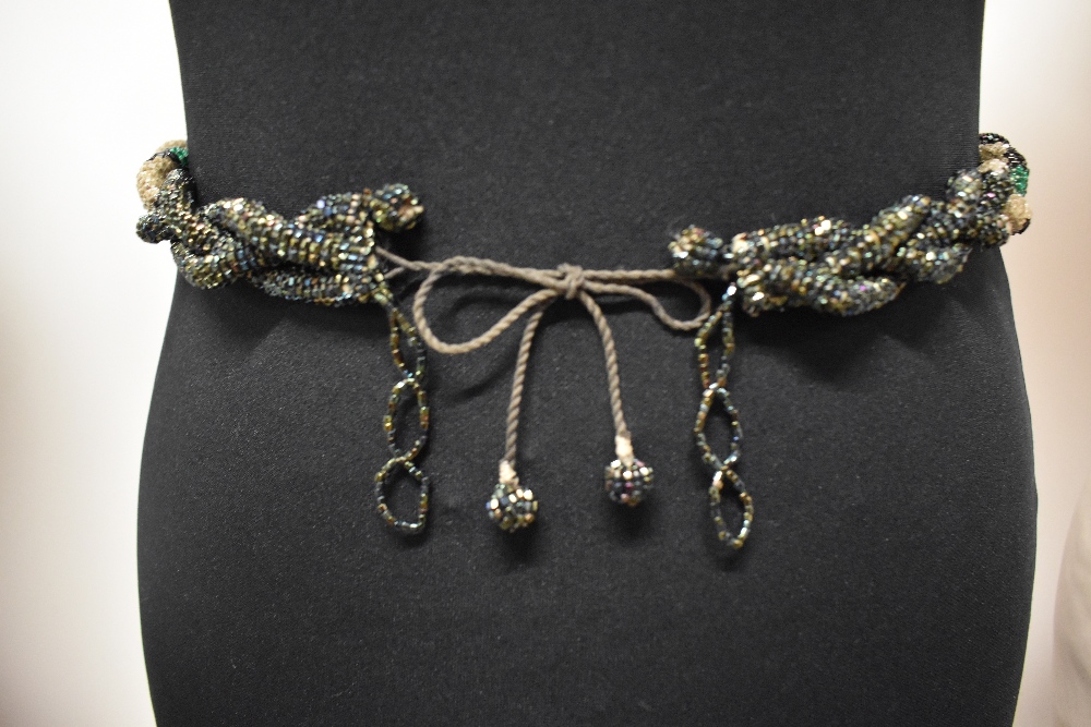 A beaded 1930s Art Deco plaited belt in clear, green and iridescent coloured beads.