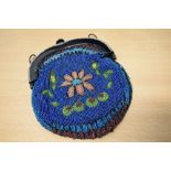 An extensively beaded late Victorian bag with bright floral designs to both sides and diamante