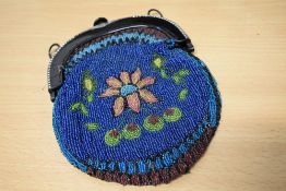 An extensively beaded late Victorian bag with bright floral designs to both sides and diamante