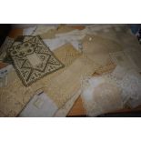 A selection of vintage and antique tray cloths and mats, beautifully hand worked items amongst