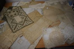 A selection of vintage and antique tray cloths and mats, beautifully hand worked items amongst