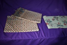A pair of Victorian polished cotton curtains, having rose and leaf pattern and a similar early