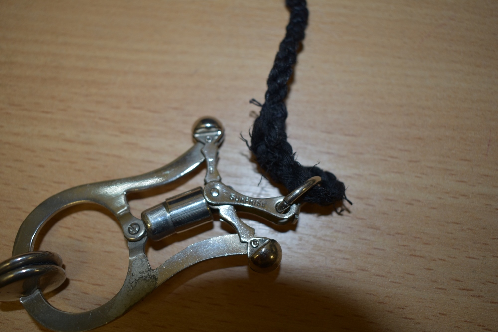 An early 20th century 'Sunrise' stainless steel skirt lifter on lanyard. - Image 3 of 3