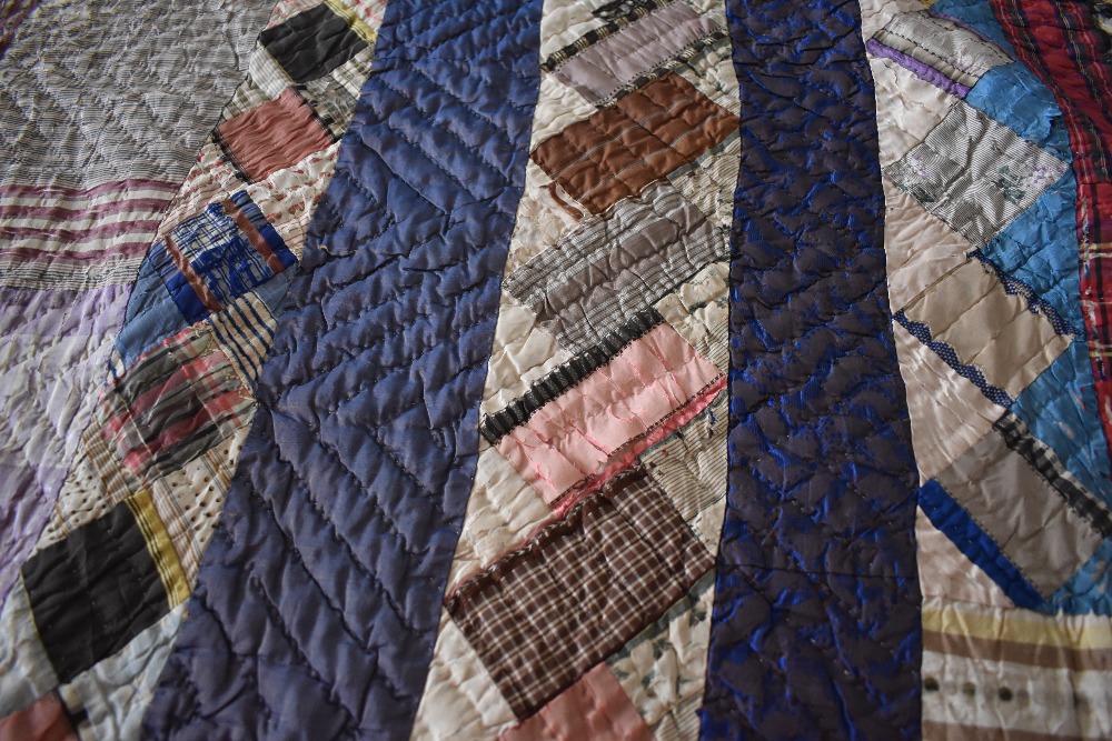 A Victorian silk quilt, having chevron cotton reverse in coffee coloured cotton, edges are - Image 4 of 7