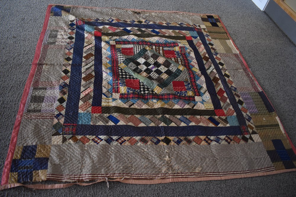 A Victorian silk quilt, having chevron cotton reverse in coffee coloured cotton, edges are