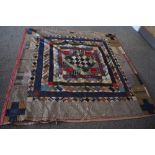 A Victorian silk quilt, having chevron cotton reverse in coffee coloured cotton, edges are