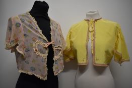 Two beautiful 1930s bed jackets, to include floral floaty sheer crepe with lace, and acid yellow