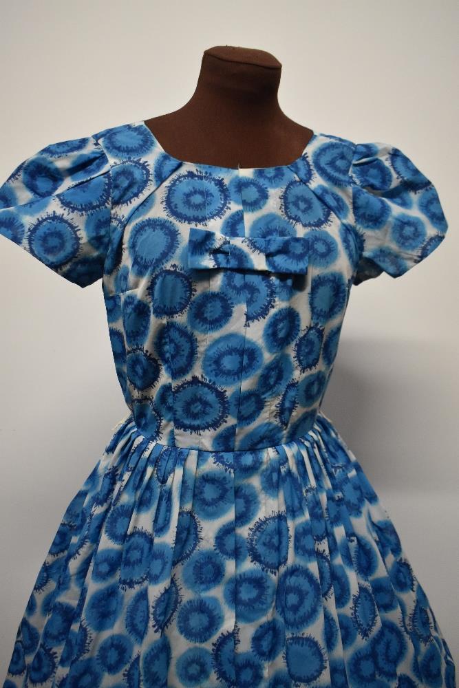 A blue 1950s day dress, having side metal zip, fairly full pleated skirt and bow detail to - Image 2 of 7