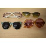 Four pairs of vintage sunglasses, including late 1950s/60s with original sticker still in places and