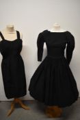 Two 1950s dresses, including full skirted dress with 3/4 sleeves and boat neckline with button