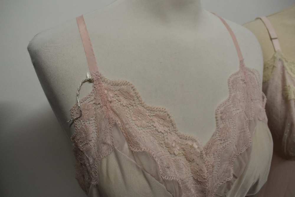 Five 1950s and 1960s sheer and semi sheer nylon slips, all having lace, medium to large sizes. - Image 4 of 12