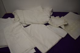 Two Victorian bed coverlets, one having embroidery and lace work, two embrodiered sheets and a