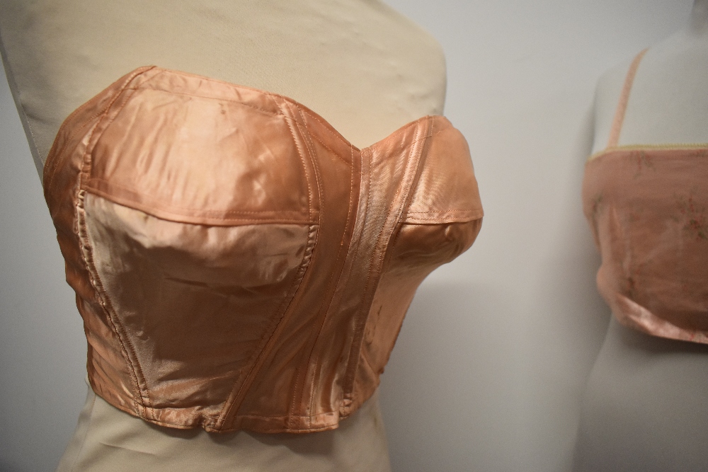 A 1940s strapless pink satin finish bra and a 1920s bralette with shirred back. - Image 6 of 10