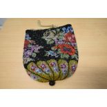 An extensively beaded Mid Victorian draw string bag with bright floral design.