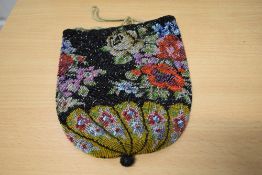 An extensively beaded Mid Victorian draw string bag with bright floral design.