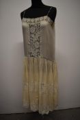 A beautiful 1920s fine cream silk and lace petticoat, small to medium size.