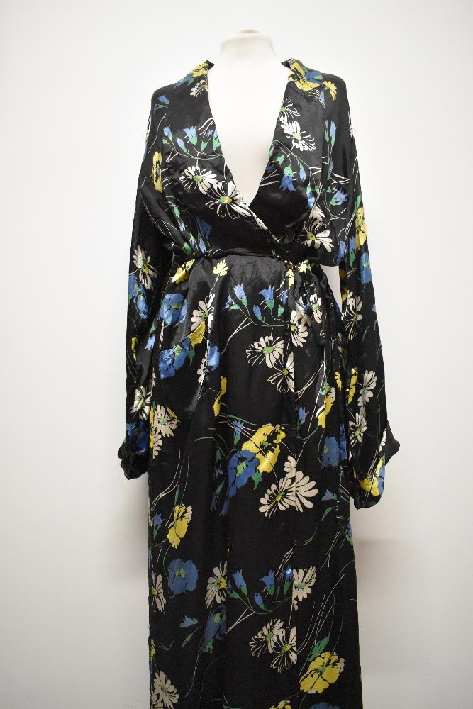 A 1940s glossy black rayon house coat, having vibrant floral pattern, very satin like to the touch. - Image 3 of 7