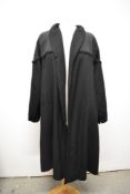 A 1950s black swing coat, having brocade and grosgrain detail to shoulders and collar, some historic